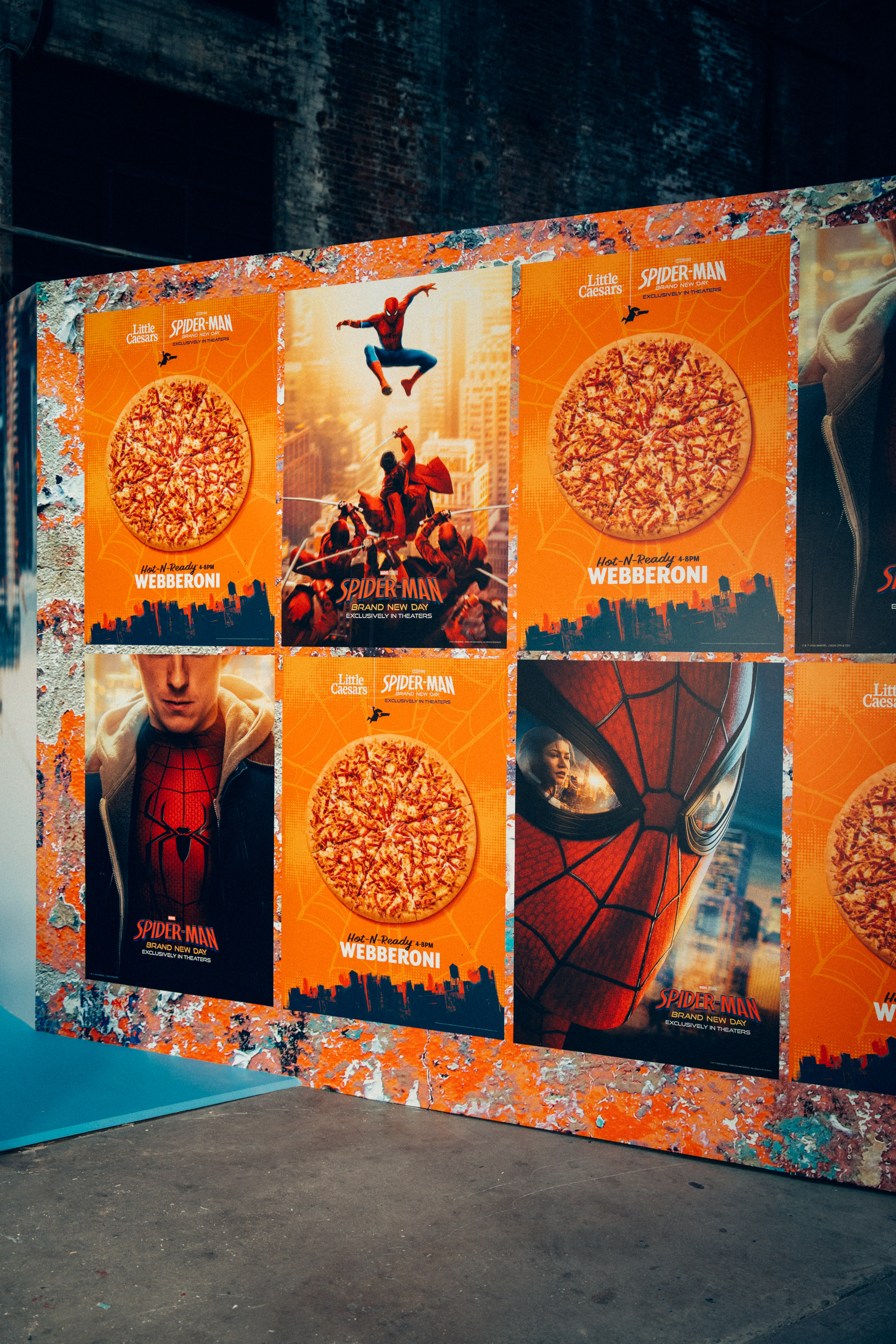 Large-format poster wall with Webberoni and Brand New Day one-sheets